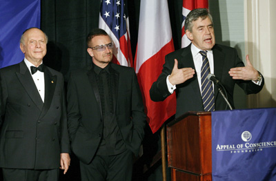 Appeal of Conscience Foundation Presents Annual Awards  in Ceremony at the Waldorf=Astoria: Rabbi Arthur Schneier, President and founder of the Appeal of Conscience Foundation( left) and Bono  look on as British Prime Minister, Gordon Brown accepts the 2009  Appeal of Conscience World Statesman Award.