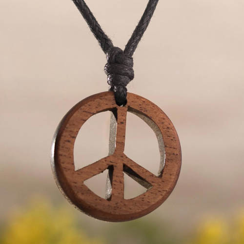 Wood Peace Sign Necklace is designed by Antoine and Santos in Peru.