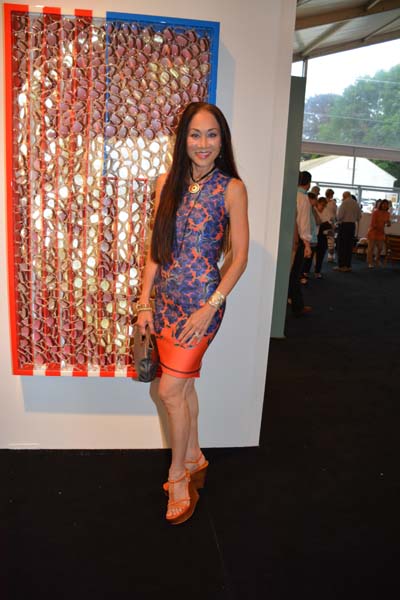 Lucia Hwong Gordon in front of JFK Flag by David Datuna from Birnam Wood Galleries.  Photo by:  Rose Billings