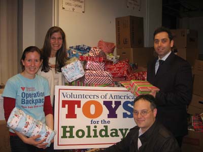 Africa Israel USA lends their support (and space at Manhattans Clock Tower Building) to Volunteers of Americas 2011 Christmas Toy Drive (from left: Kristin Kelly-Jangraw of Volunteers of America and Laurie Golub, Damien Stein and Ilya Braz of 