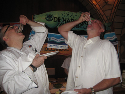 06-25-10 Oyster Bar Executive Chef Sandy Ingber (L) and Former Minnesota Twins pitcher Bert Blyleven taste Dutch herring before receiving the "Greatest Dutch Sportsman" Award at Grand Central Oyster Bar