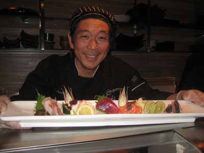 04-25-12 Chef Masaki Nakayama presents a plate of sashimi at a special tasting party to celebrate the one-year anniversary of Mr. Robata Restaurant. 1674 Broadway