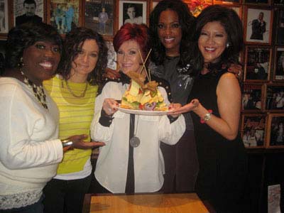 12-11-11 Co-hosts of CBS' "The Talk" (L-R) Sheryl Underwood. Sara Gilbert. Sharon Osbourne. Aisha Tyler. Julie Chen unveil the new TALKwich sandwich at Carnegie Deli. 854 7th Ave. Sunday afternoon 12-10-11