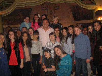 01-12-12 "Newsies" Director and choreographer Jeff Calhoun (center) is surrounded by Broadway Kids Care young Broadway performers after a Q & A at "Dinner with a Director" Education Series in the New Amsterdam Room in the New Amsterdam Theatre. 214 West 42nd St. Wednesday afternoon 01-11-12