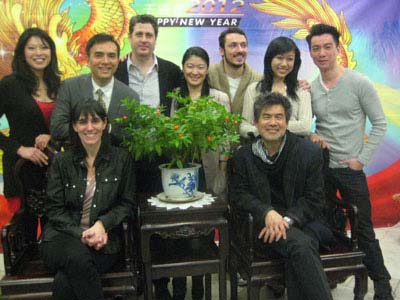 01-06-12 Cast members (L-R) Christine Lin. Larry Lei Zhang. Gary Wilmes. Jennifer Lim. Stephen Pucci. Angela Lin. Johnny Wu (seated. director Leigh Silverman. playwright David Henry Hwang at a press conference and celebration of the 100th performance of "Ch'ing-lish" at the Lin Sing Association. 47-49 Mott St. Thursday afternoon 01-05-12