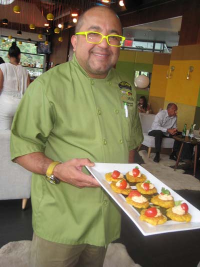 07-15-15 Executive Chef Frank Maldonado serves hors d'oeuvres. plantain with hummus and tomato at a food tasting at Sofrito. Riverbank State Park. Riverside Drive at 144th St. Tuesday night. 07-14-15.  Photo by:  Aubrey Reuben