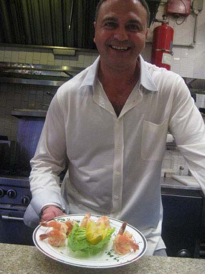 05-08-12 Owner/chef Justin Alioni with a dish of shrimp scampi at a tasting paty at Justino's Pizzeria & Restaurant. 451 Third Ave. Tuesday night 05-08-12