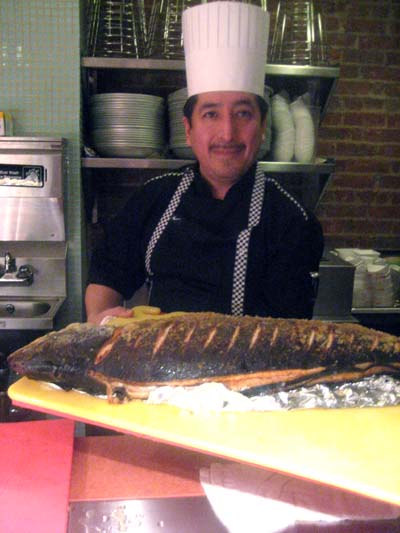 10-29-13 Chef Fred Mero presents a whole salmon at a media food tasting at La Rosetta.243 West 14th St.. Monday night 10-28-13. photo by: aubrey reuben