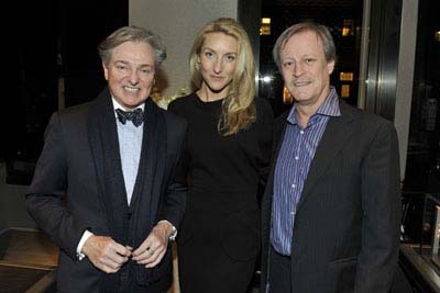 Interior designer, Geoffrey Bradfield with hosts of the Vertu dinner, Casey Gorman and Patrick McMullan