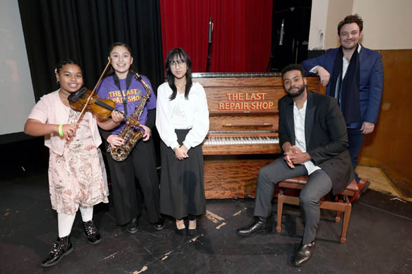 Student storytellers featured in the Oscar nominated film, The Last Repair Shop,Porch Brinker, Ismerai Calcaneo, and Amanda Nova pose with co-directors Kris Bowers and Ben Proudfoot. Photo by Todd Williamson