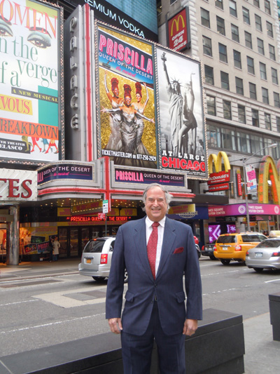 Stewart F. Lane owner of the Palace Theater in front of the marquis for