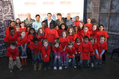 Titled Smash and Renfroe  students from Renfroe Middle Scholl in Decatur pose with Smash producers and actors. Adults from left: Smash executive producer Neil Meron, Smash actor Jaime Cepero, Smash actor Brian dArcy James, Smash actor Christian Borle and Smash producer Craig Zadan. Photo credit: Wilford Harewood/NBC