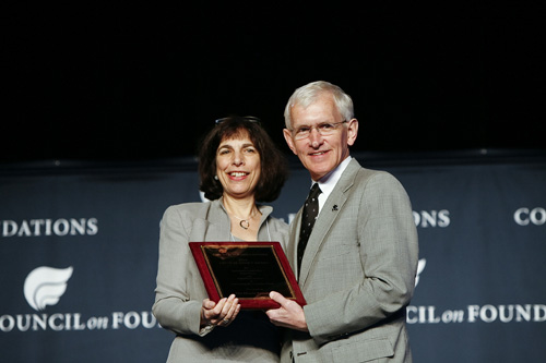 Barbara Dyer, President and CEO of The Hitachi Foundation (left) accepts the 2010 Critical Impact Award from Steve Gunderson, President and CEO of the Council of Foundations during the Council on Foundations annual conference 