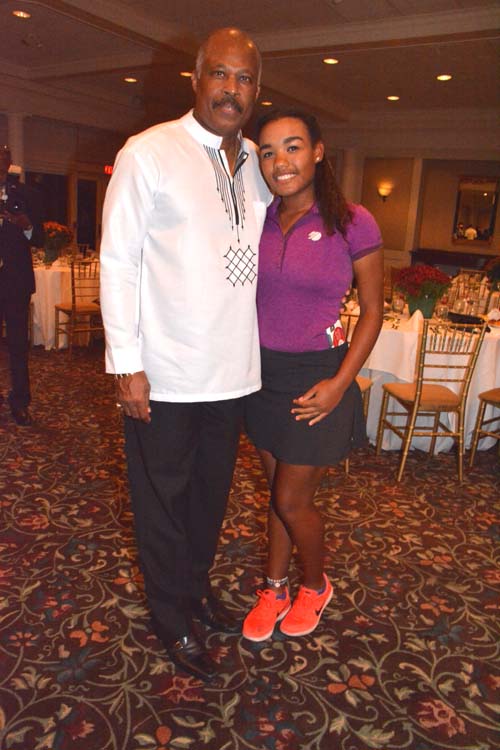 Vice Chancellor Sir Hilary Beckles and Kyra Cox (golfer) .  Photo by:  Rose Billings/Blacktiemagazine.com