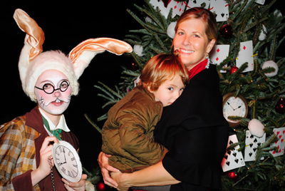 Robin Azqueta and son Norberto by the John Tenniel-Alice and Wonderland tree decorated by Patrick Killian