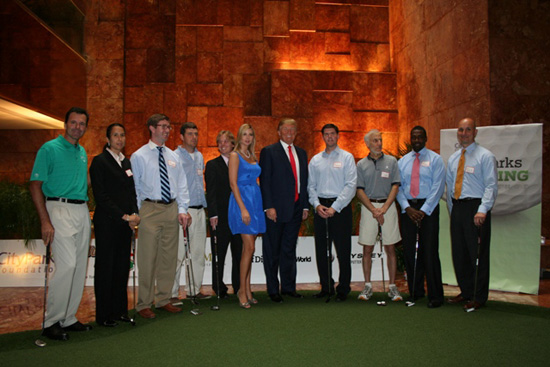 PGA Pro Len Mattaice (far right), Ivanka Trump and Donald Trump (center) and the winners of CityParks Putting Challenge at Trump Tower atrium