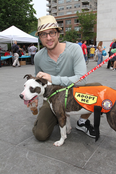 Actor Zach Braff pets adoptable dog at Adoptapalooza in Washington Square Park on Saturday, May 22.