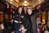 USMC Cpl. Aaron Mankin, Travis Coursey and Patricia Kennedy on the vintage trolley that carried guest from the Auditorium Theatre to the Palmer House for the Joffrey Nutcracker Family Dinner.Photo by: David Crotty/Patrick McMullan Company