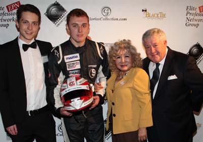 Race Car Driver Luca Forgeois and Gloria T. Cressler Event Producer and President & Founder Elite Professional  Networking Group & Editor Black Tie International Magazine