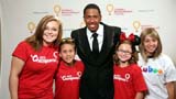 Nick Cannon, center, and Child Champions are seen at the 2012 Children's Miracle Network Hospitals' Champions Medals Ceremony, on Friday, Sept. 21, 2012, at Walt Disney World in Orlando, Fla. (Photo by Marc Serota/Invision for Children's Miracle Network Hospitalss/AP Images)