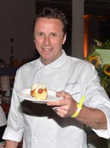 Chef Marc Murphy serves up his signature Ditch Dog at City Harvests 2013 Summer in the City.   Photo by:  Andrew Walker, Getty Images 