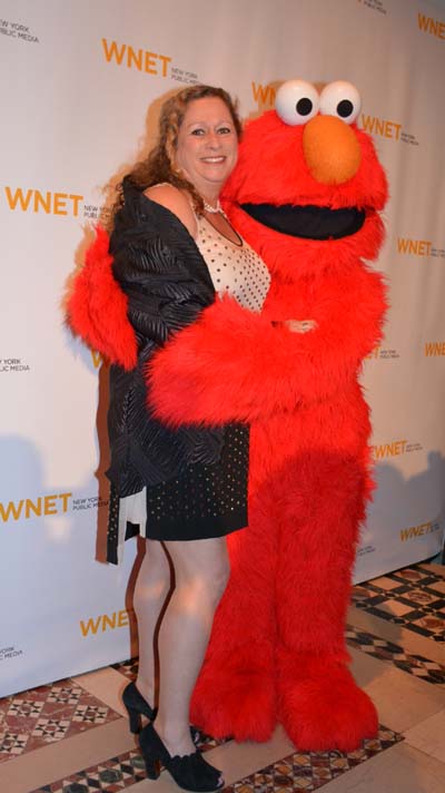 Abigail Disney and Elmo.  Photo by:  Rose Billlings/Blacktiemagazine.com