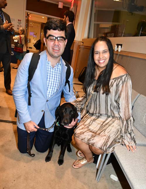 Couple attending the event with seeing eye dog