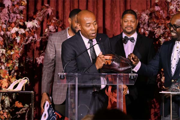 Bernard Adams donating Mayor Adams' shoes