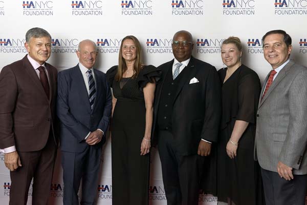 Vijay Dandapani, President and CEO, Hotel Association of New York City, and event co-chair; Jonathan M. Tisch, Executive Chairman, Loews Hotels & Co; Susan Santiago, President, United States and Canada, Hyatt Hotels and Resorts, and Hospitality Award honoree; Richard R. Buery, Jr., Chief Executive Officer, Robin Hood, and Humanitarian Award honoree; Heather Davis, Chair, Hotel Association of New York City Foundation, and event co-chair.  photo by: AK Photo