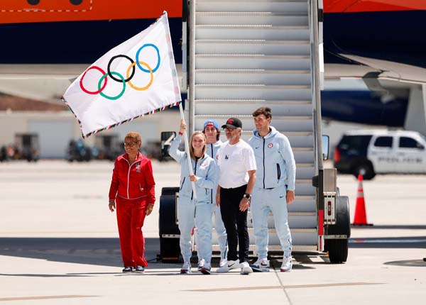 Los Angeles Mayor Karen Bass, Tate Crew, Micah Maʻa, Delaney Schnell, and LA28 Chairperson and President Casey Wasserman arrive to LA from Paris with Olympic Flag on Delta LA28 livery on August 12, 2024 in Los Angeles, California. 