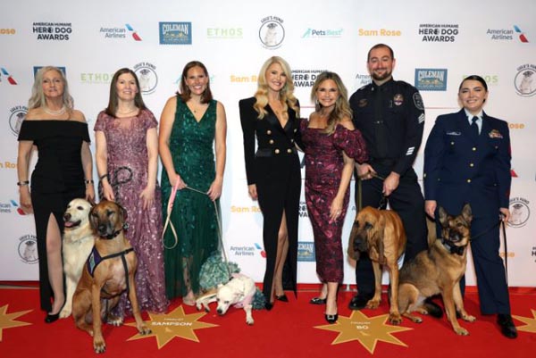 Joey Ramp-Adams, Liz Stewart, Lindsey Peetz, Christie Brinkley, Robin Ganzert, Sgt. David Rowland, Petty Officer Alesha Horn, Sampson. photo courtesy getty images