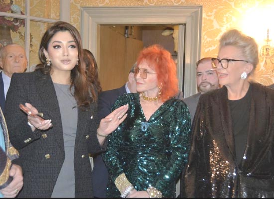 Co-host Zeever Baqar speaking, with Dr. Judy Kuriansky and Ambassador Bogyay