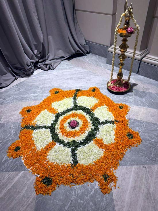 Fresh marigold and mogra wheel from Indian flag, depicting 24 hours of the day- each to be lived consciously.