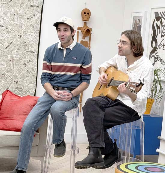 The Lazour brothers playing a selection from the musical at a private reception 