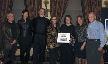 Tsipi Ben-Haim, Executive & Creative Director of CITYarts, holding an photograph of Grant's Tomb, pictured 80 years ago and as it is today with CITYarts' mosaic bench surrounding it, a gift received by Carrie Cohen, Chairperson of CITYarts' Board of Directors, on her right. Also pictured, (from left to right) Daniel Libeskind, who architectural work was celebrated that evening; members of CITYarts' Board of Directors, Vera Sung, Amnon Bar-Tur and Irene Minkoff; and, on the far right, Henry Buhl, who hosted the inspiring event in his home