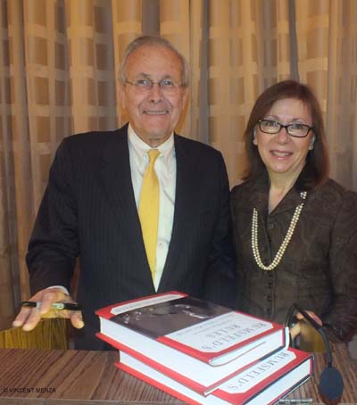 Donald Rumsfeld signing books for Irena Holiat Photo by:  Vincent Menza