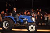 Jay Leno drives Lil Tug onto the auction floor in Scottsdale,AZ just before the bidding begins