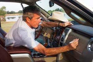 President George W. Bush signs the dashboard of his 2009 Ford F-150 King Ranch 4x4 SuperCrew Pickup Truck, auctioned this weekend by Barrett-Jackson in Scottsdale, AZ, raising $300,000. Proceeds benefit Fisher House Foundation.