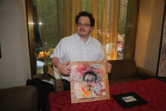   Artist Indorato in his artist table