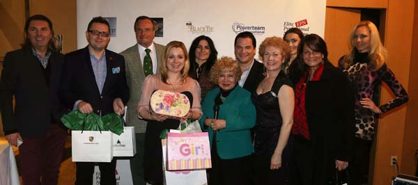 Sabina Klimek the Trade Commissioner of Poland with her gifts for her baby's baby shower from the guests in the picture