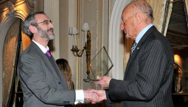 Joshua Greene (Left) is presented with the Wine Leader Award by Lucio Caputo.