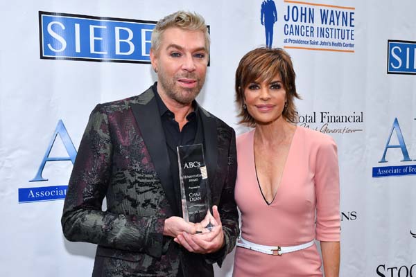 Lisa Rinna (right) presented the Humanitarian Award to Chaz Dean (left)