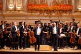 Cellist Yo-Yo Ma and Maestro Valery Gergiev take a bow in front of the Mariinsky Orchestra after their performance